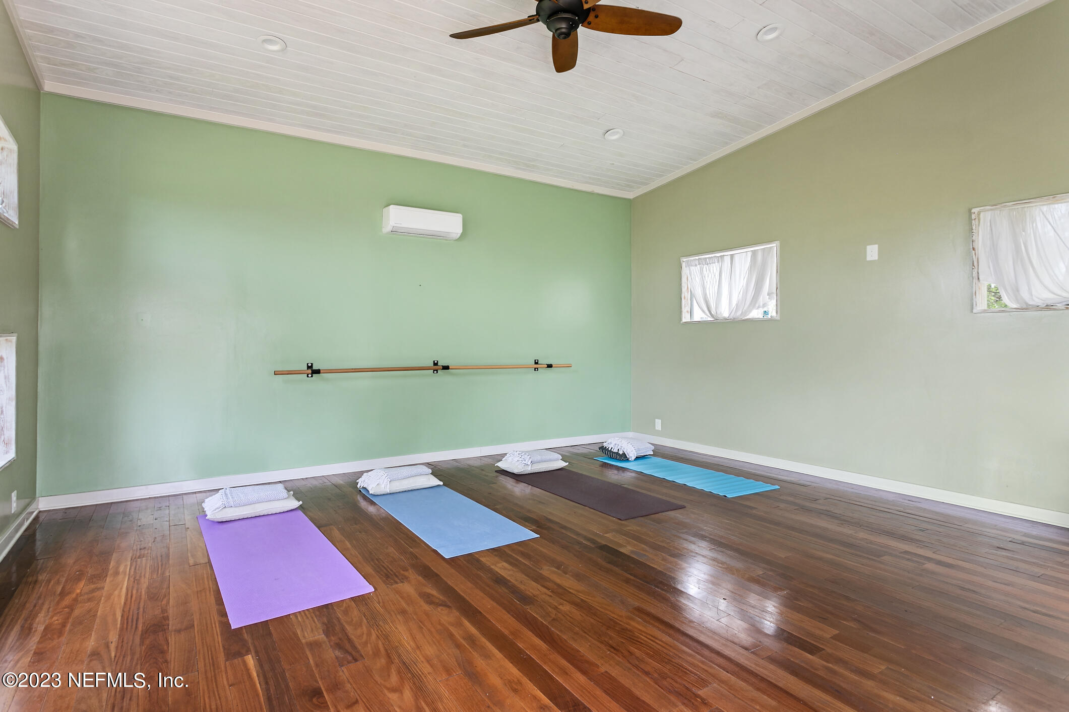 1 Hopson Road Jacksonville Beach, FL 32250 - Photo 45 of 58 a view of a big room with wooden floor and windows