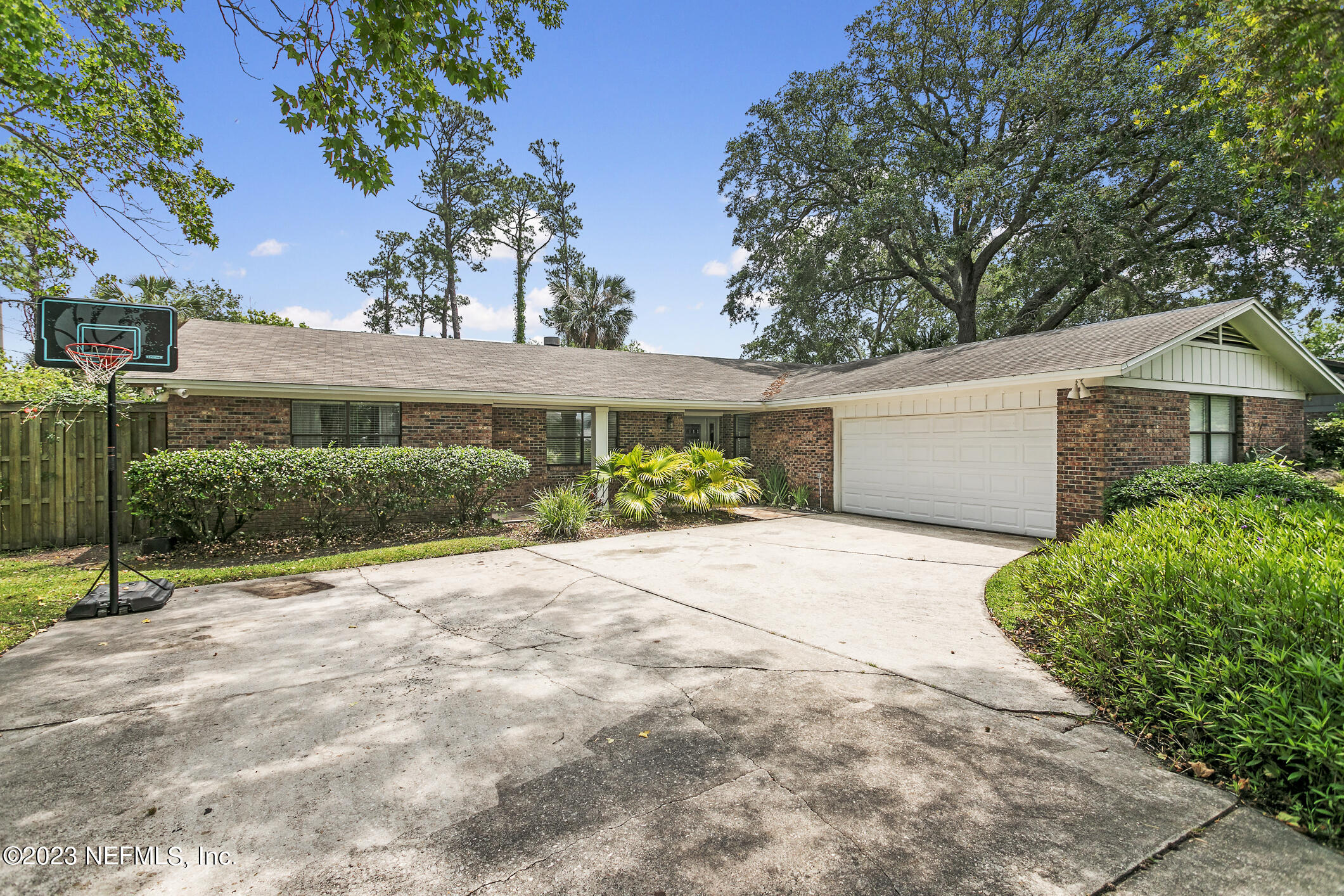 1 Hopson Road Jacksonville Beach, FL 32250 - Photo 50 of 58 a view of a house with a yard and potted plants