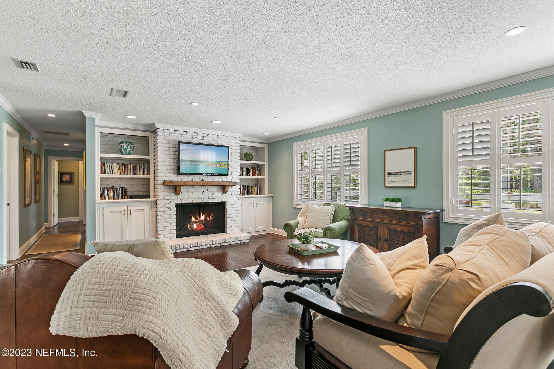 1 Hopson Road Jacksonville Beach, FL 32250 - Photo 6 of 58 a living room with furniture and a fireplace