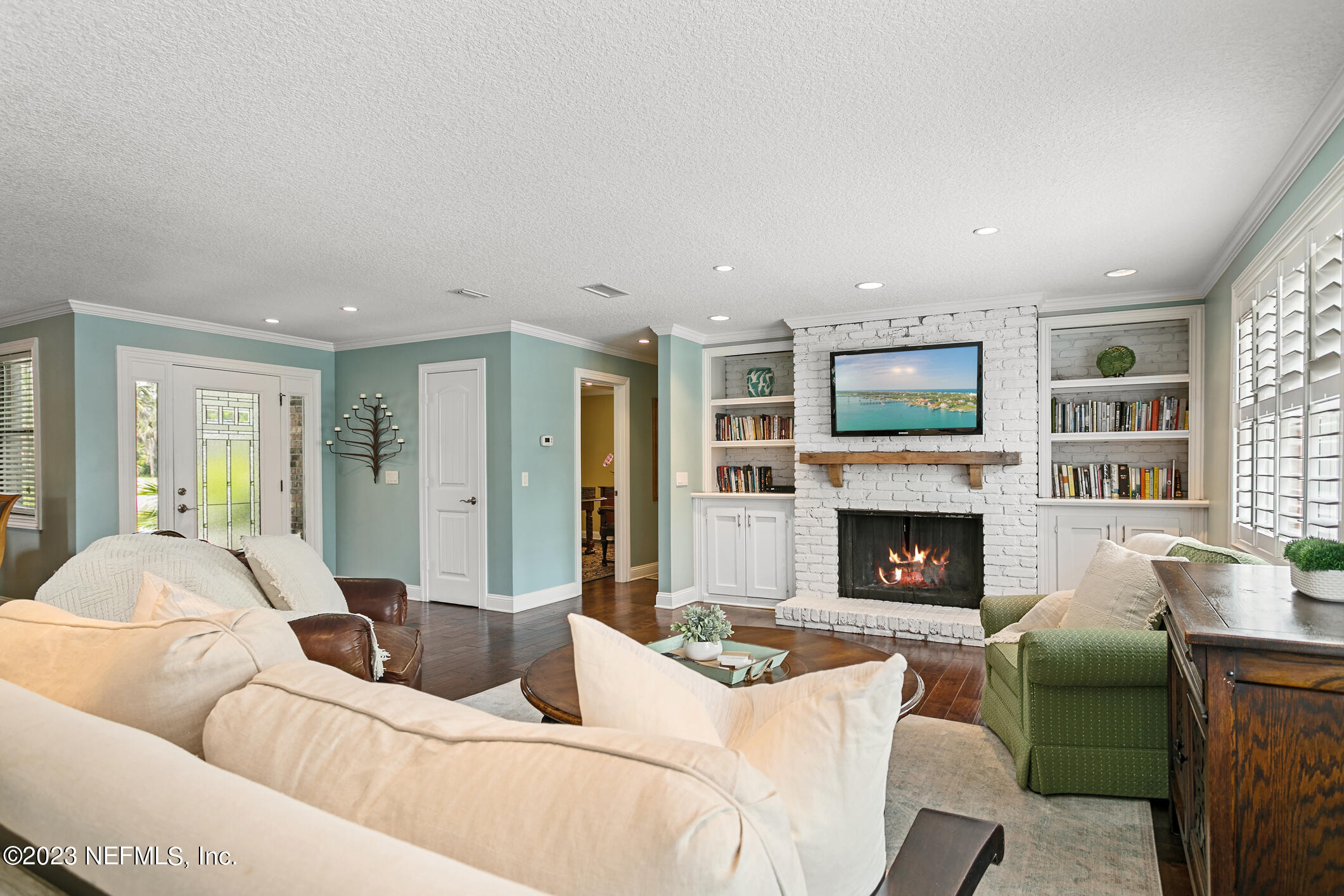 1 Hopson Road Jacksonville Beach, FL 32250 - Photo 7 of 58 a living room with furniture and a fireplace