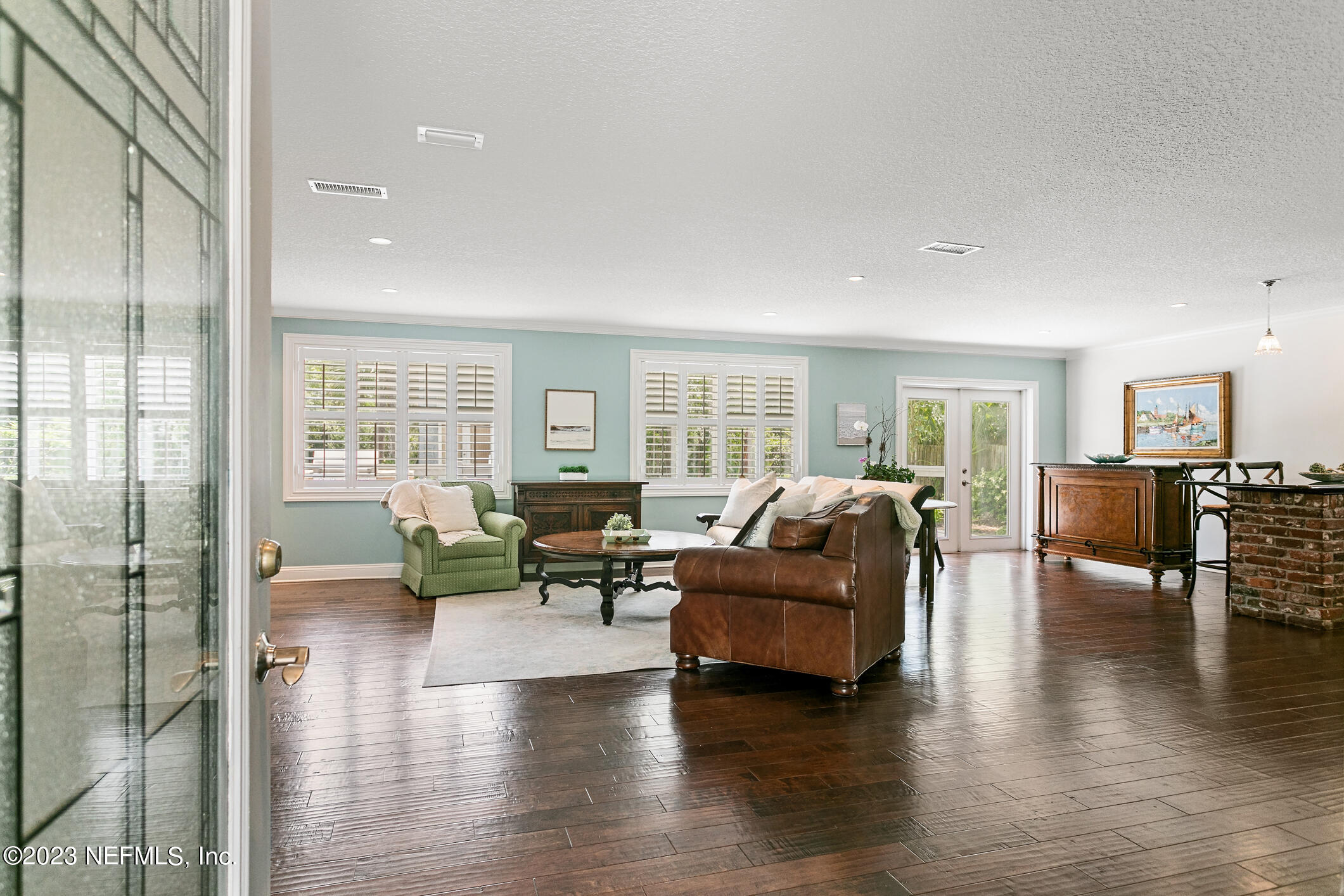 1 Hopson Road Jacksonville Beach, FL 32250 - Photo 8 of 58 a living room with furniture and a large window