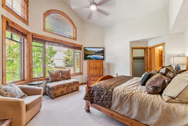 a bedroom with a bed and a view of bathroom