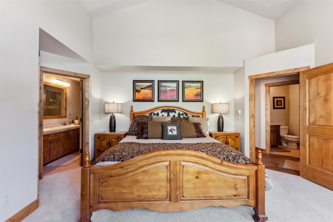 24 Rasor Drive, Unit 24 Keystone, CO 80435 - Photo 13 of 29 a bedroom with a bed and a view of bathroom