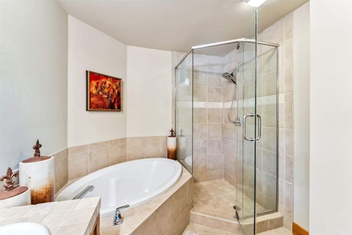 24 Rasor Drive, Unit 24 Keystone, CO 80435 - Photo 15 of 29 a bathroom with a tub and shower