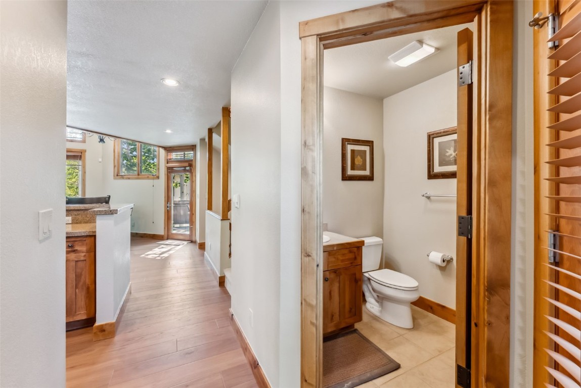 24 Rasor Drive, Unit 24 Keystone, CO 80435 - Photo 17 of 29 a bathroom with a toilet sink and a mirror