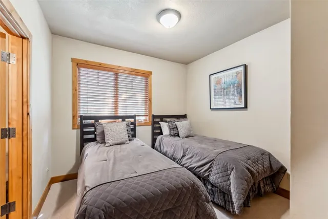a view of a patio with a table and chairs