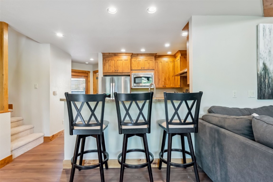 24 Rasor Drive, Unit 24 Keystone, CO 80435 - Photo 10 of 29 a view of a dining room with furniture and wooden floor