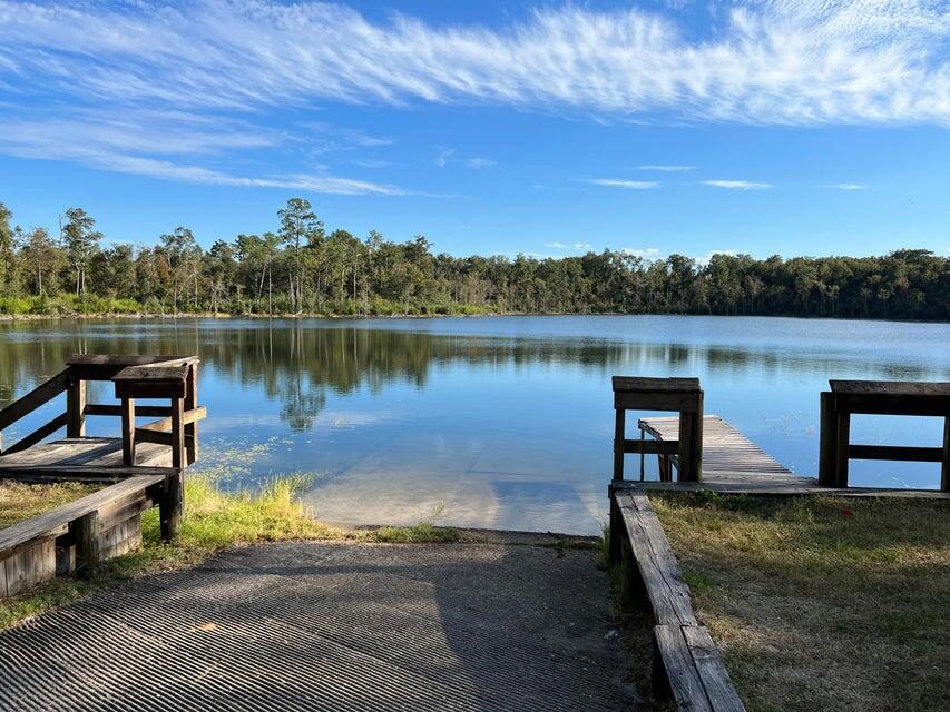 Lot 46 Murphy Court Chipley, FL 32428 - Photo 4 of 12 a view of a lake with a floor to ceiling window next to a yard