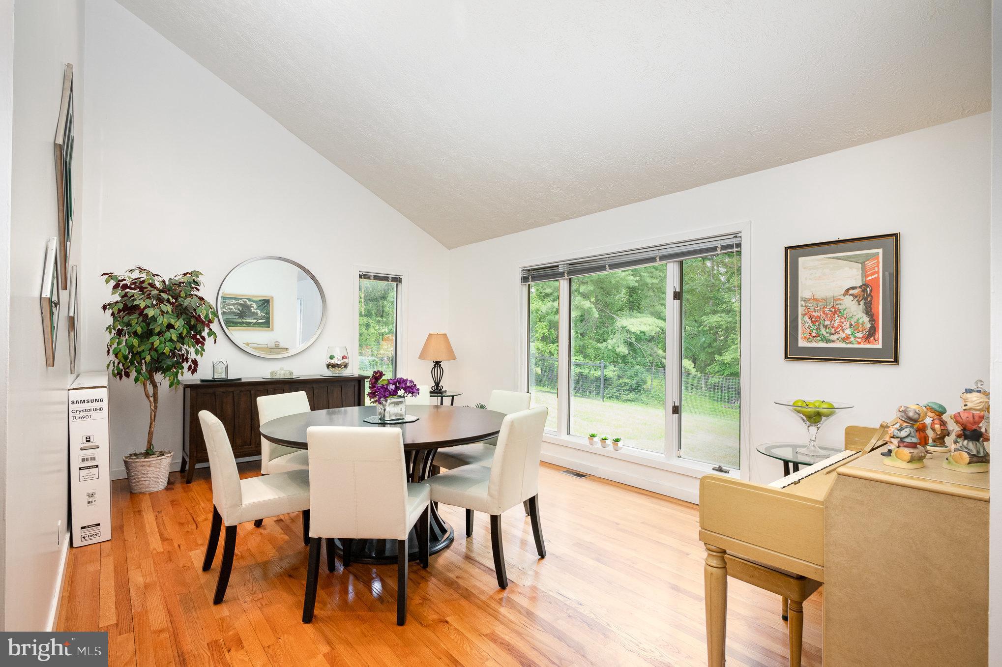16222 Hampton Road Hamilton, VA 20158 - Photo 12 of 35 a view of a dining room with furniture a potted plant and a wooden floor
