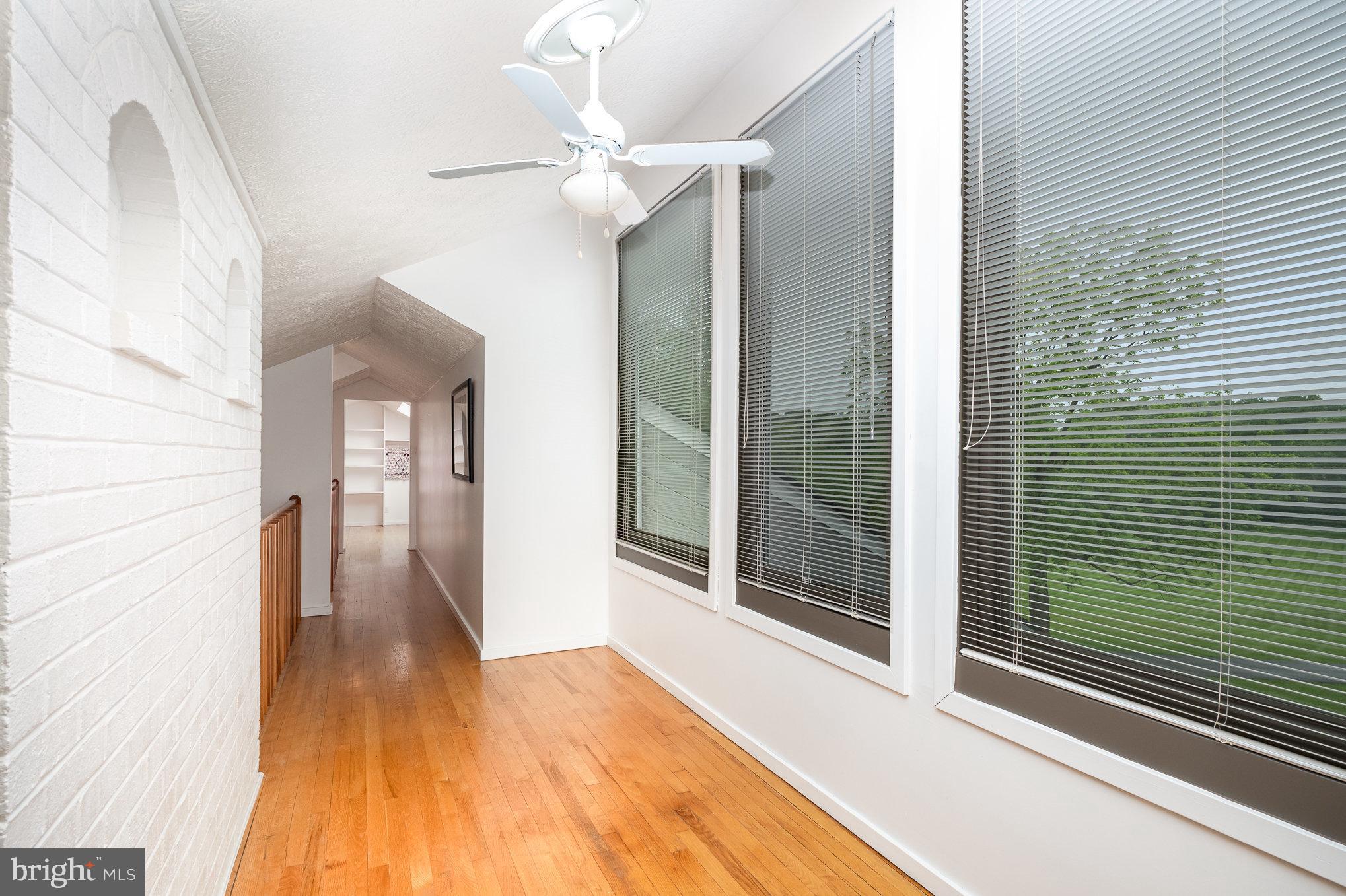 16222 Hampton Road Hamilton, VA 20158 - Photo 22 of 35 a view of a hallway with wooden floor and staircase