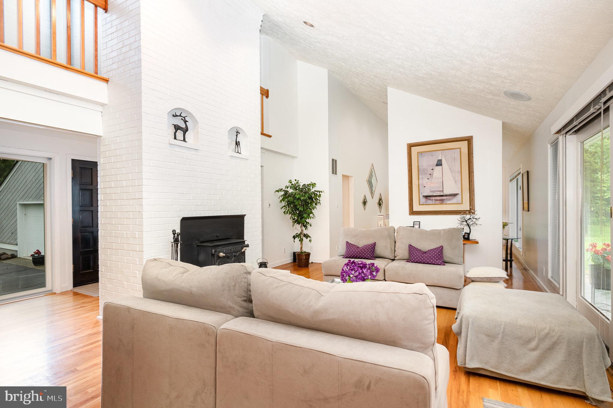 16222 Hampton Road Hamilton, VA 20158 - Photo 6 of 35 a living room with furniture and a fireplace