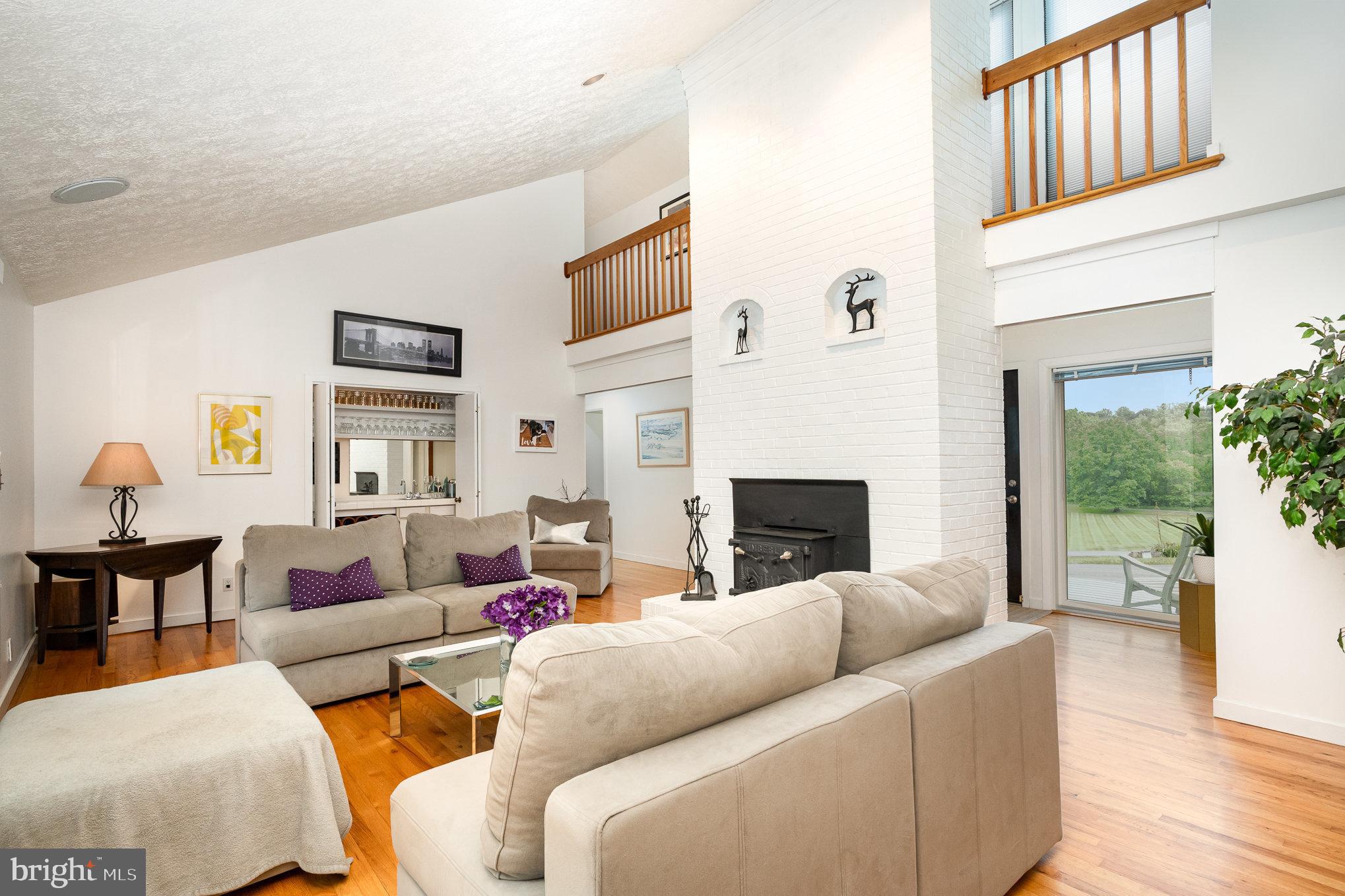16222 Hampton Road Hamilton, VA 20158 - Photo 7 of 35 a living room with furniture and a fireplace