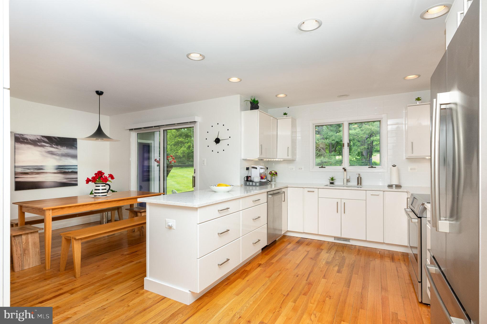 16222 Hampton Road Hamilton, VA 20158 - Photo 9 of 35 a kitchen with stainless steel appliances sink stove and white cabinets