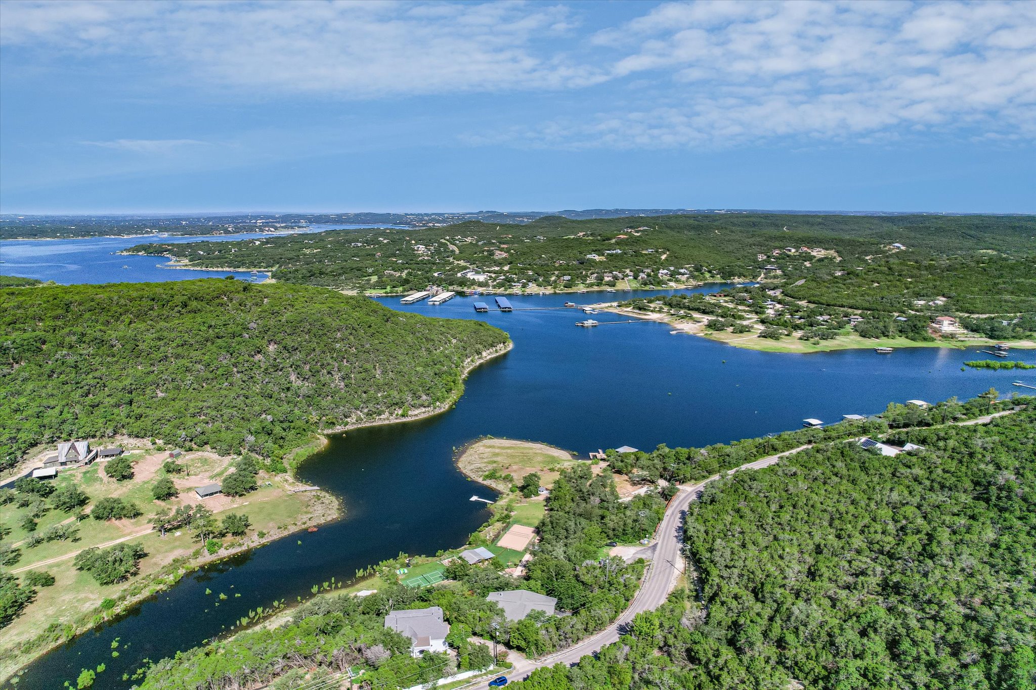 13401 Bullick Hollow Road Austin, TX 78726 - Photo 1 of 40 a view of a lake with a building in the background