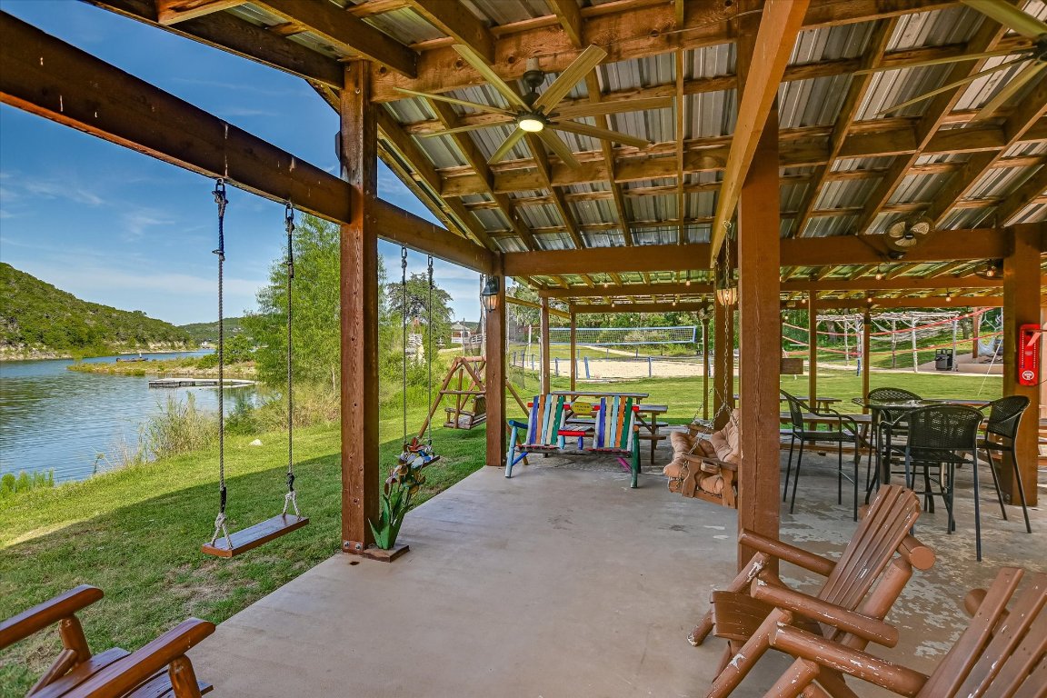 13401 Bullick Hollow Road Austin, TX 78726 - Photo 12 of 40 a view of a patio with table and chairs next to an umbrella