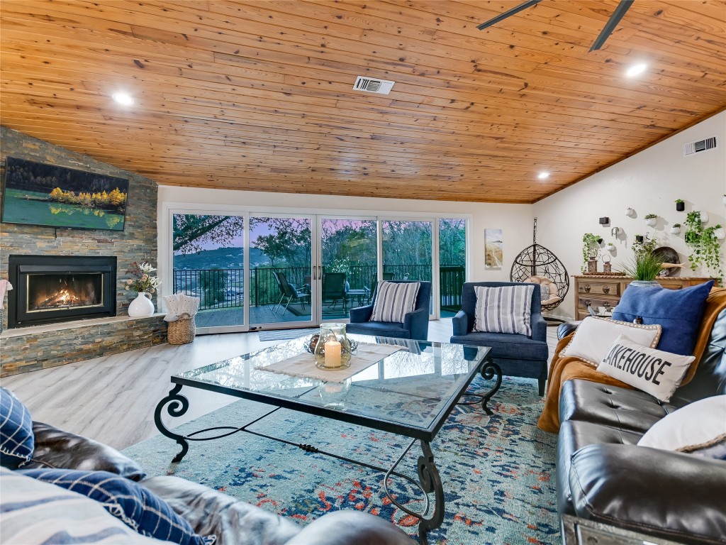 13401 Bullick Hollow Road Austin, TX 78726 - Photo 22 of 40 a living room with furniture and a fireplace