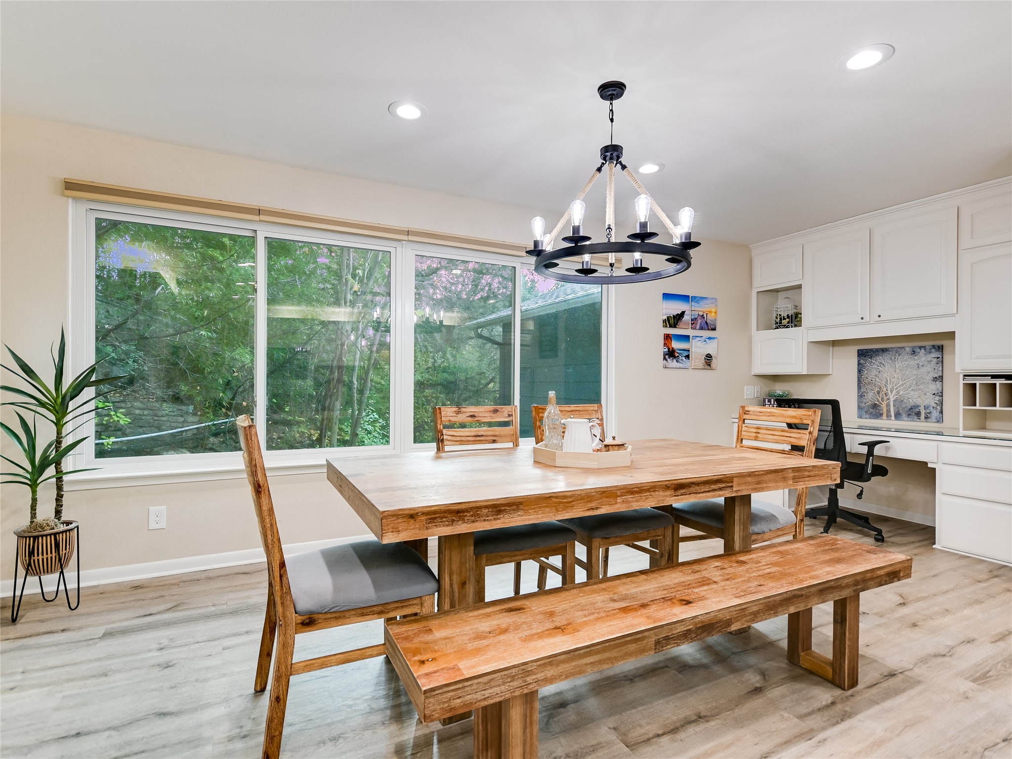 13401 Bullick Hollow Road Austin, TX 78726 - Photo 24 of 40 a view of a dining room with furniture wooden floor and chandelier