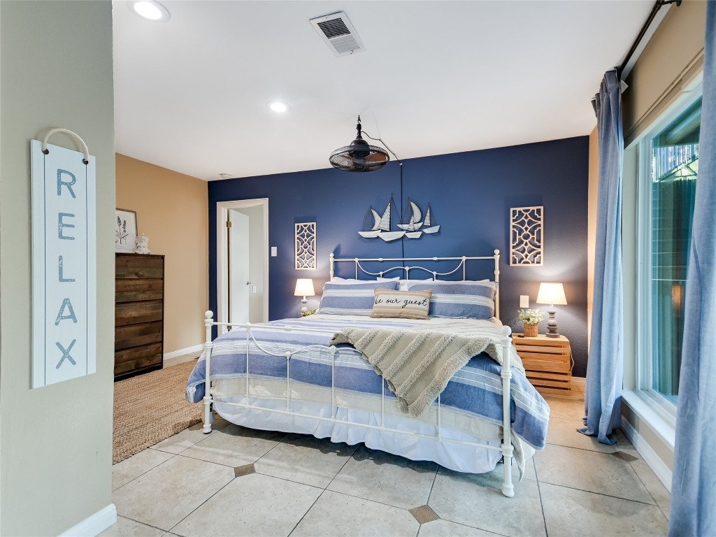 13401 Bullick Hollow Road Austin, TX 78726 - Photo 35 of 40 a living room with furniture and a chandelier