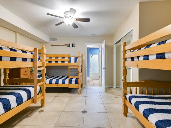 a room with a sink and chairs