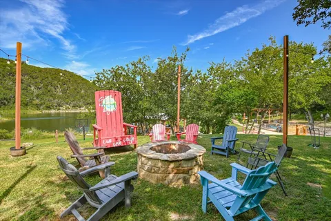 a view of a patio with table and chairs and potted plants