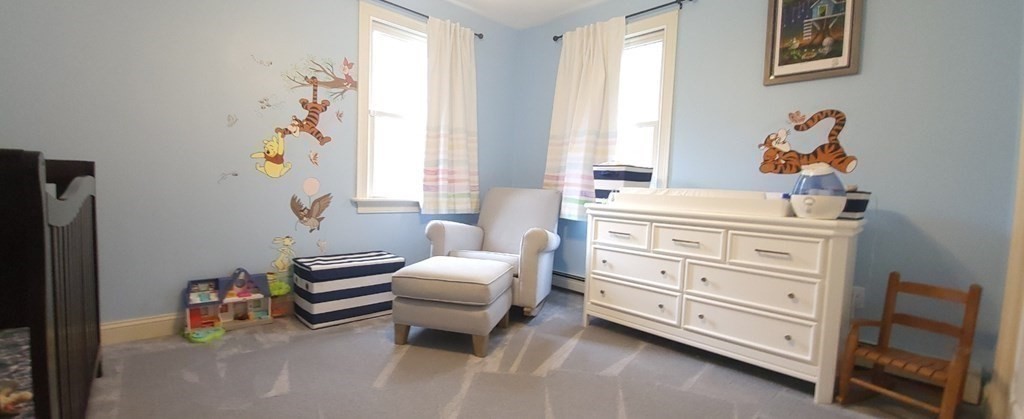 60 Marble Road Sutton, MA 01590 - Photo 12 of 21 a room with a baby bed couch and a window