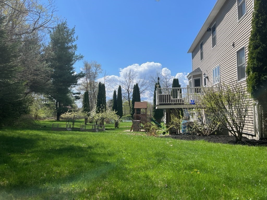 60 Marble Road Sutton, MA 01590 - Photo 2 of 21 a view of a house with a big yard and large trees