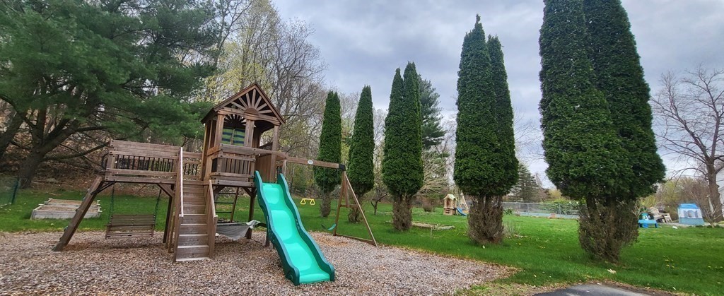 60 Marble Road Sutton, MA 01590 - Photo 3 of 21 a view of a park with plants and a large tree