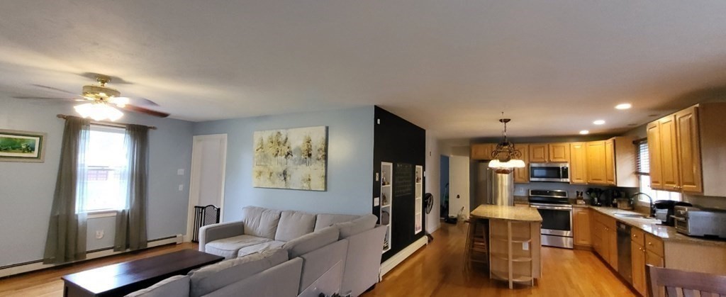 60 Marble Road Sutton, MA 01590 - Photo 9 of 21 a living room with lots of furniture and kitchen view