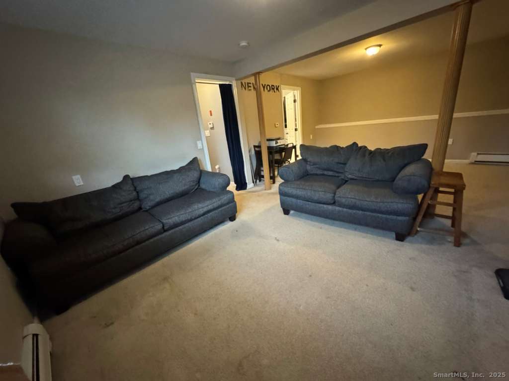 158 Swain Avenue Meriden, CT 06450 - Photo 20 of 25 a living room with furniture and a couch