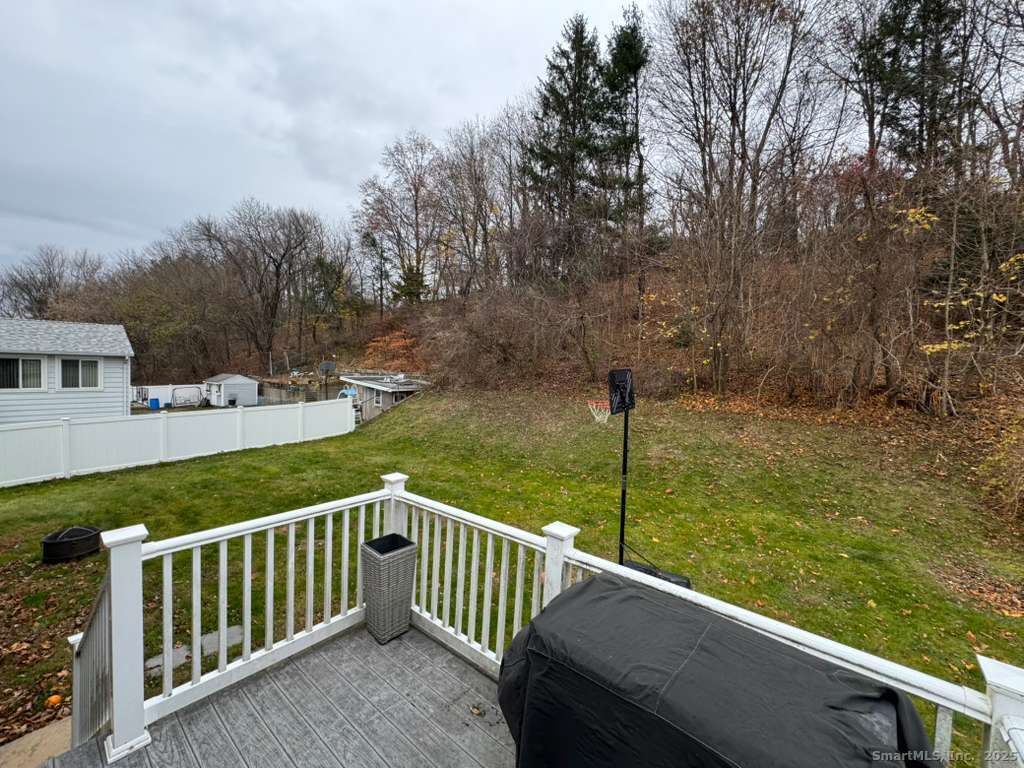 158 Swain Avenue Meriden, CT 06450 - Photo 24 of 25 a view of a wooden deck with a yard