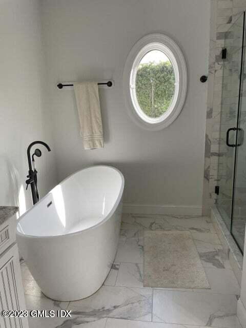 8 Sound Beach Ave Extension, Unit 2 Riverside, CT 06878 - Photo 13 of 29 a white tub sitting next to a shower