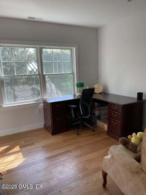 8 Sound Beach Ave Extension, Unit 2 Riverside, CT 06878 - Photo 16 of 29 a room with furniture and a large window