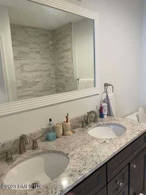 8 Sound Beach Ave Extension, Unit 2 Riverside, CT 06878 - Photo 20 of 29 a bathroom with sink and mirror