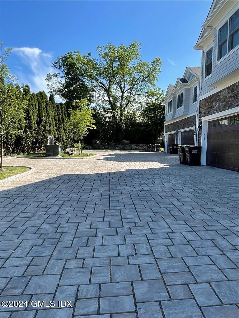 8 Sound Beach Ave Extension, Unit 2 Riverside, CT 06878 - Photo 2 of 29 a view of a yard with an buildings and trees