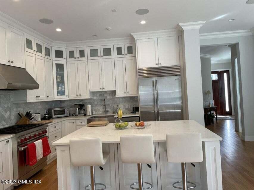 8 Sound Beach Ave Extension, Unit 2 Riverside, CT 06878 - Photo 8 of 29 a kitchen with stainless steel appliances granite countertop a sink a stove and a refrigerator