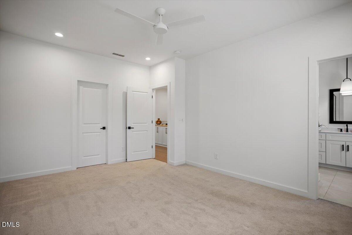 6419 Tanner Oak Lane Raleigh, NC 27613 - Photo 24 of 39 a view of a hallway with a bathroom