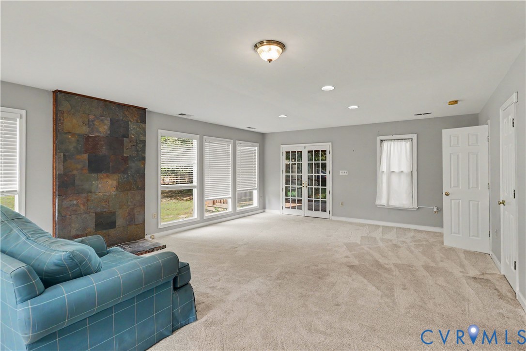 4803 Coleman Road Richmond, VA 23230 - Photo 6 of 54 Spacious living area featuring a stone accent wall