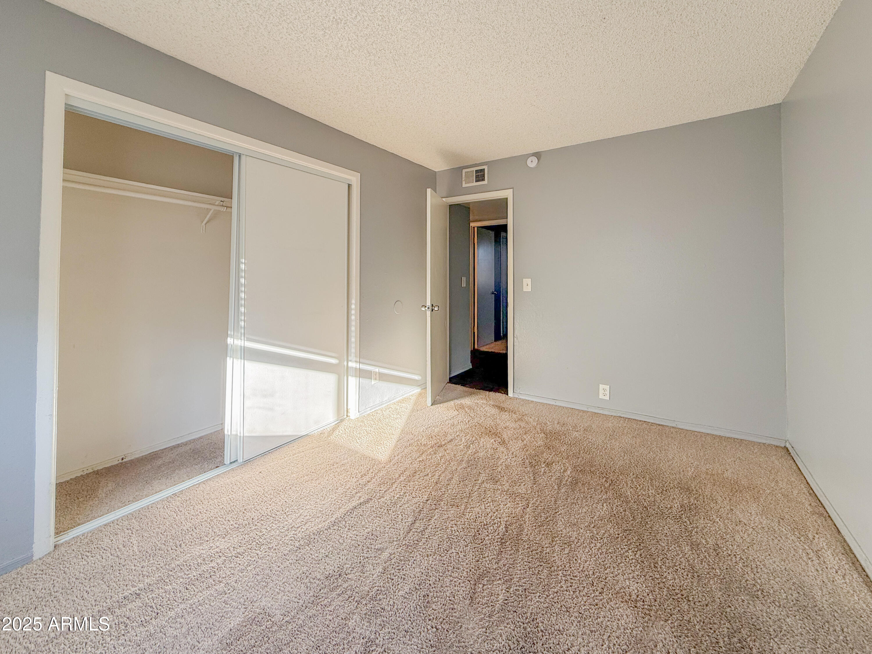 15601 North 27th Street, Unit 14 Phoenix, AZ 85032 - Photo 14 of 16 a view of an empty room