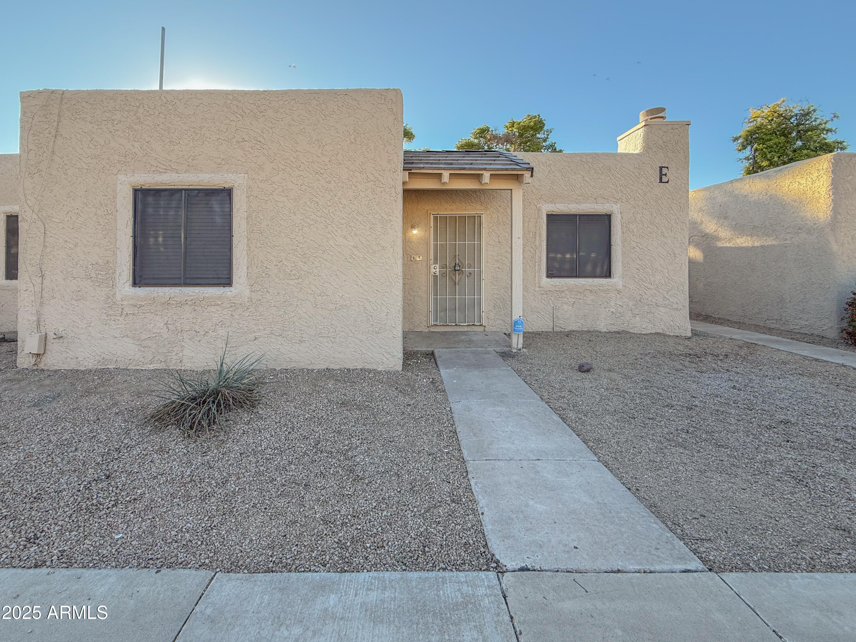 15601 North 27th Street, Unit 14 Phoenix, AZ 85032 - Photo 2 of 16 a backyard of a house
