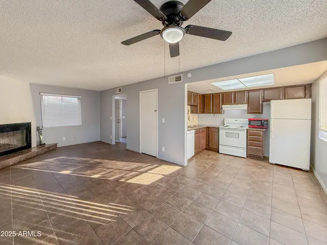 a view of a kitchen with a stove cabinets and a kitchen