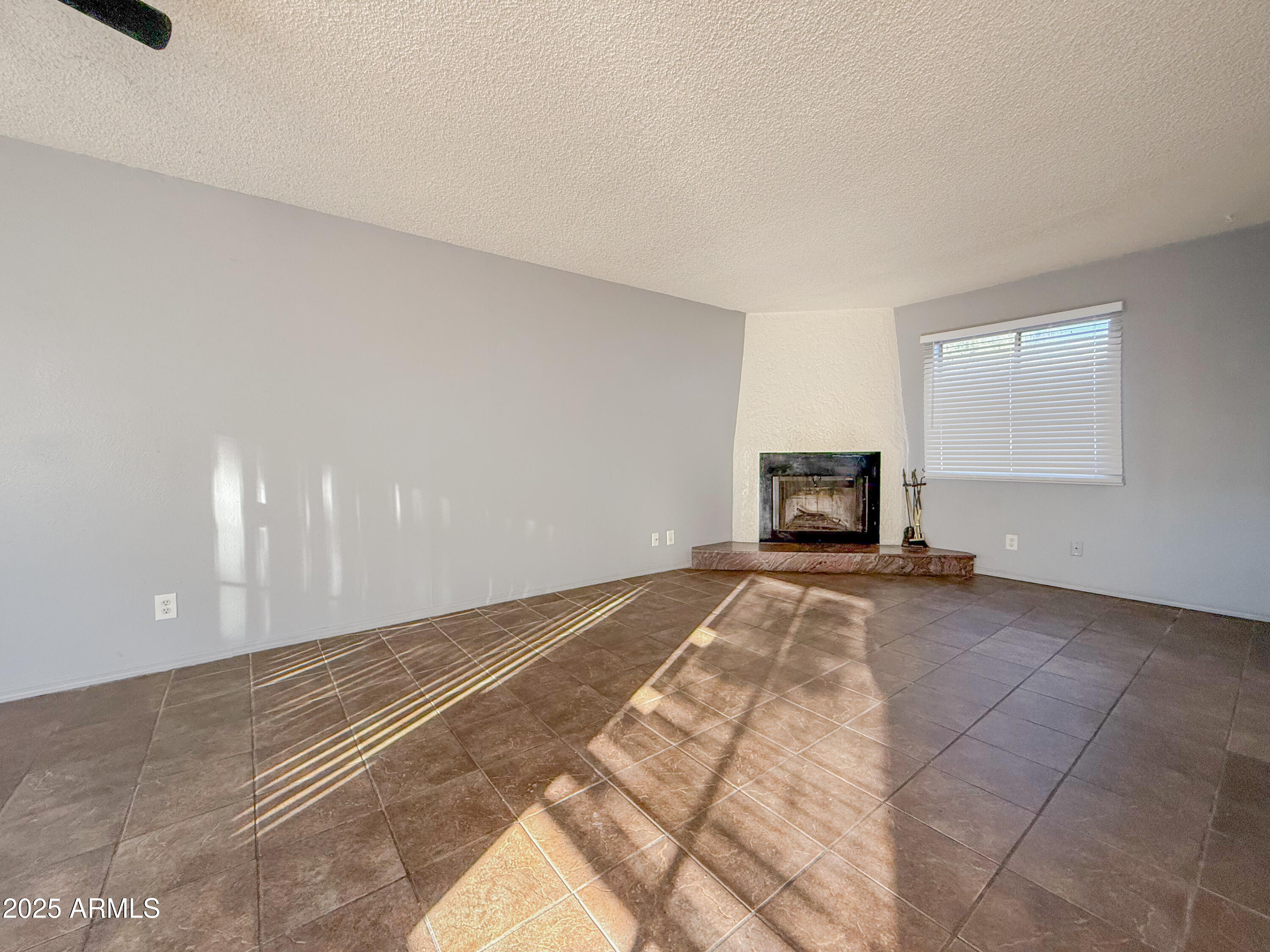 15601 North 27th Street, Unit 14 Phoenix, AZ 85032 - Photo 7 of 16 a view of empty room with wooden floor