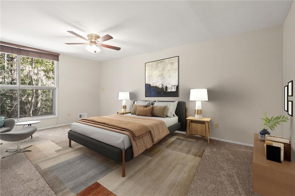 705 Edgewater Trail Sandy Springs, GA 30328 - Photo 6 of 36 a spacious bedroom with a bed and window