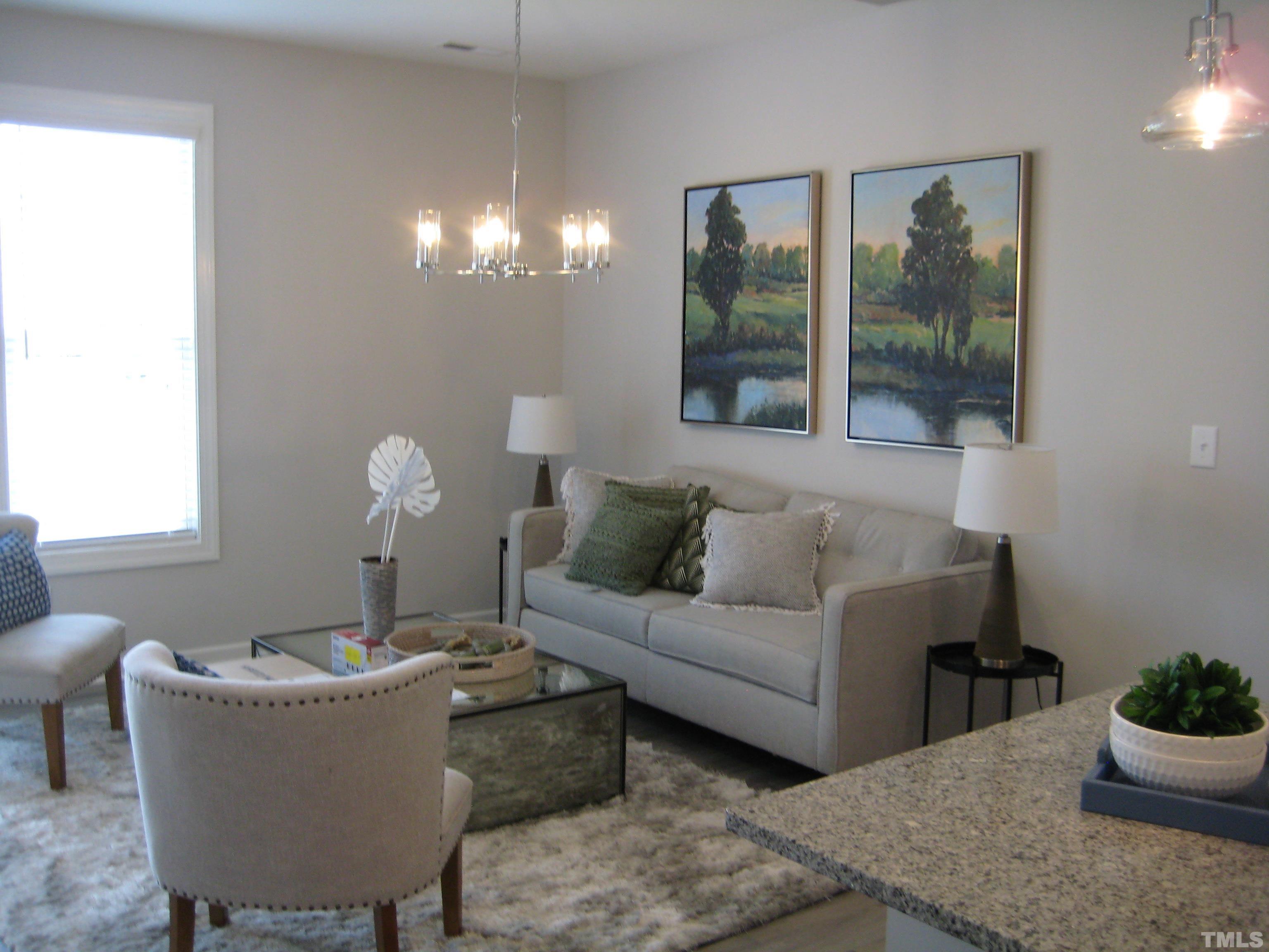 131 Rolesville Ridge Drive Rolesville, NC 27571 - Photo 4 of 8 a living room with furniture and a large window