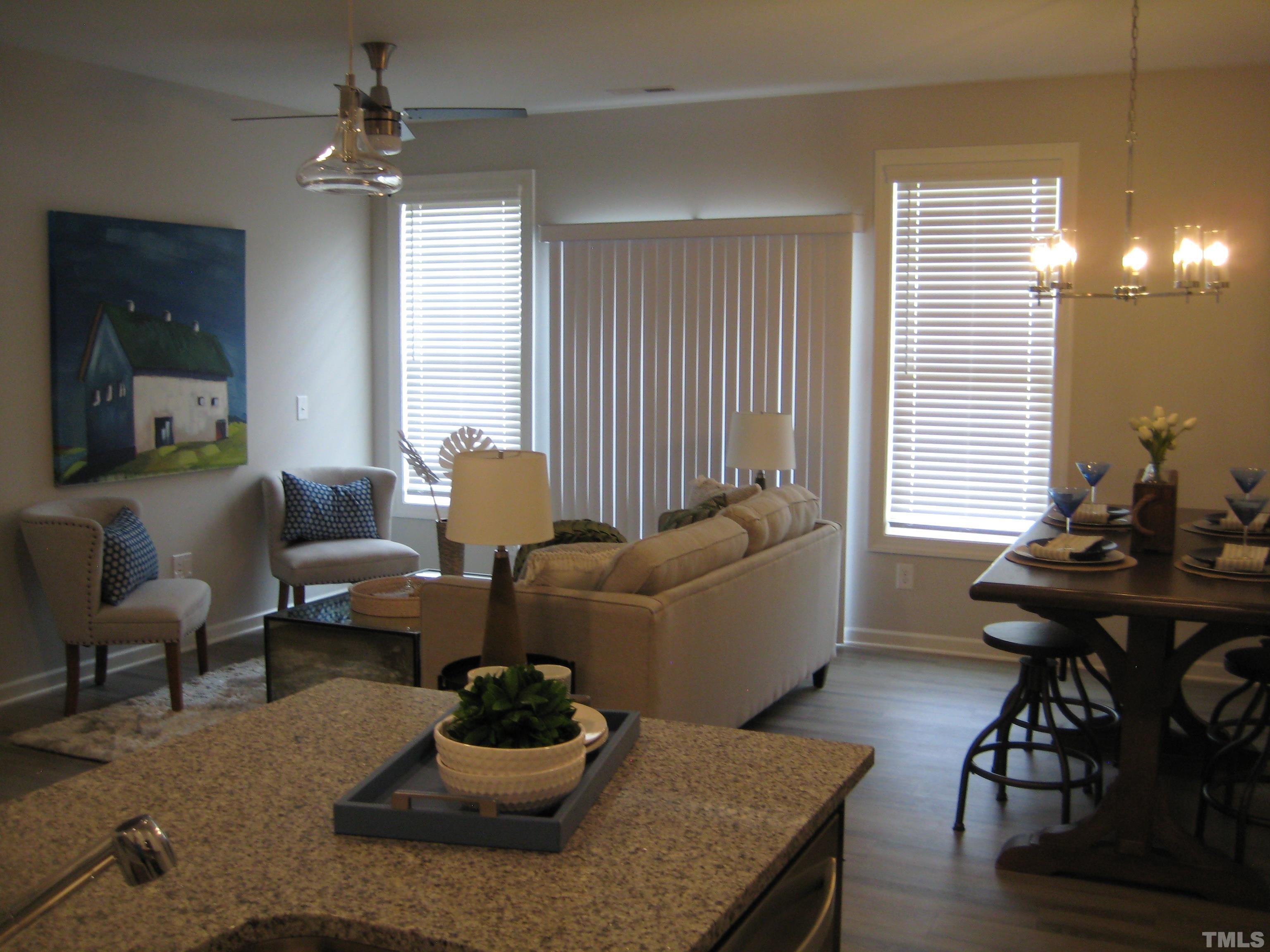 131 Rolesville Ridge Drive Rolesville, NC 27571 - Photo 5 of 8 a living room with furniture and wooden floor