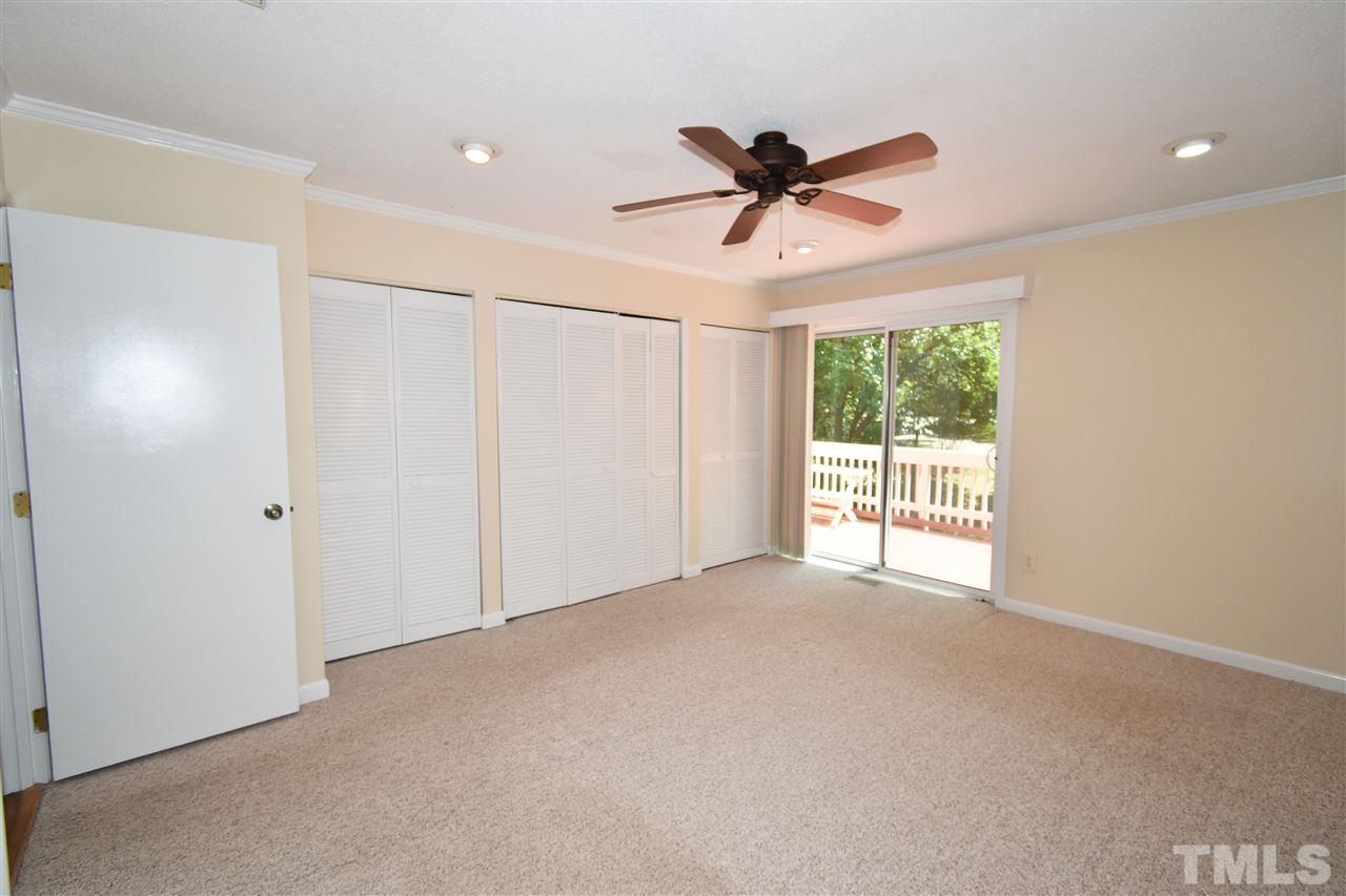 710 Green Ridge Drive Raleigh, NC 27609 - Photo 11 of 26 a view of a livingroom with a ceiling fan and window