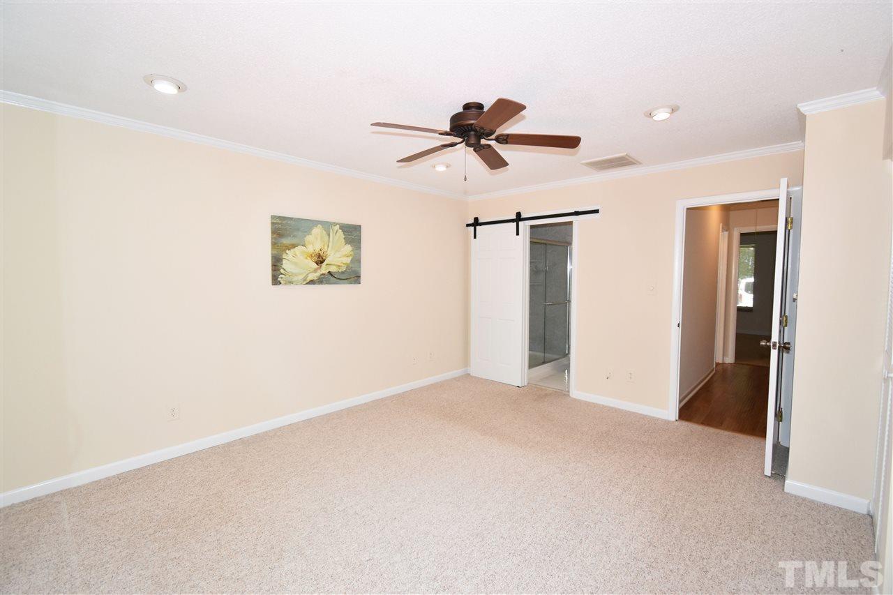 710 Green Ridge Drive Raleigh, NC 27609 - Photo 12 of 26 a view of room with a ceiling fan