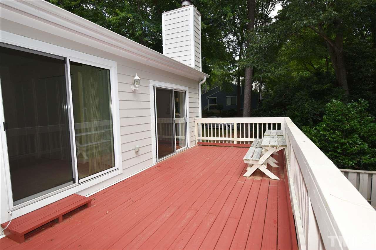 710 Green Ridge Drive Raleigh, NC 27609 - Photo 16 of 26 a view of balcony with wooden floor and fence