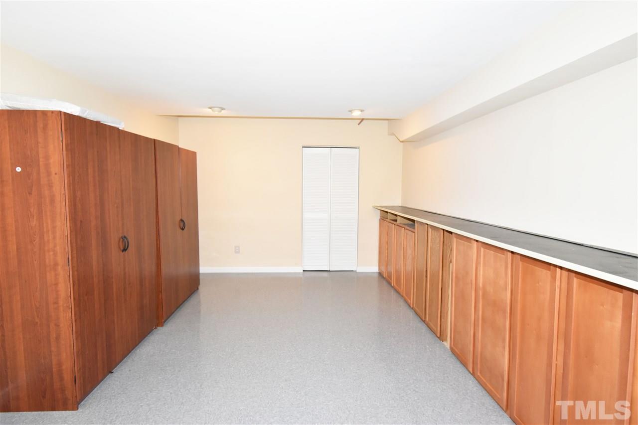 710 Green Ridge Drive Raleigh, NC 27609 - Photo 23 of 26 a view of a hallway with wooden floor
