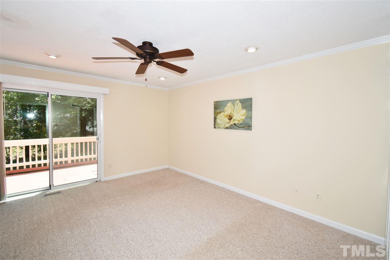 710 Green Ridge Drive Raleigh, NC 27609 - Photo 10 of 26 a view of a livingroom with a ceiling fan and window