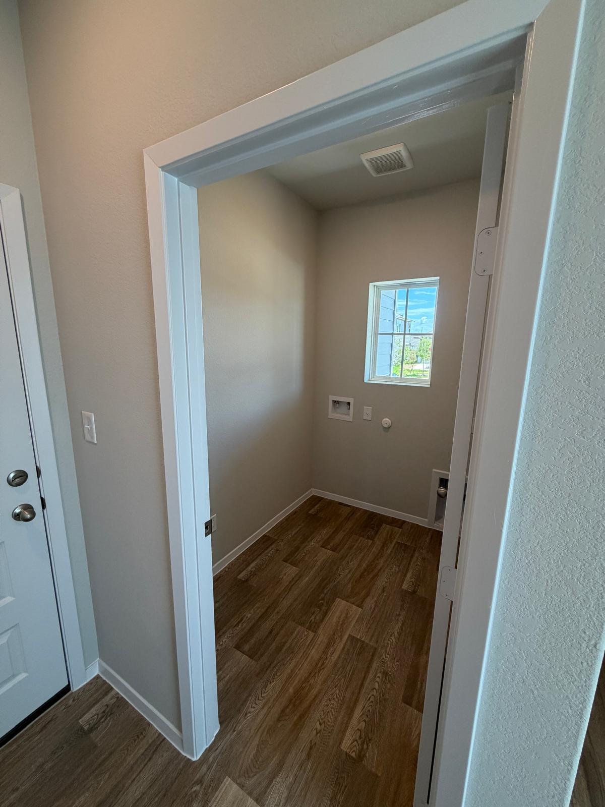 2612 Towy Road Manor, TX 78653 - Photo 8 of 35 A dedicated laundry room with ample space and easy-care flooring awaits.